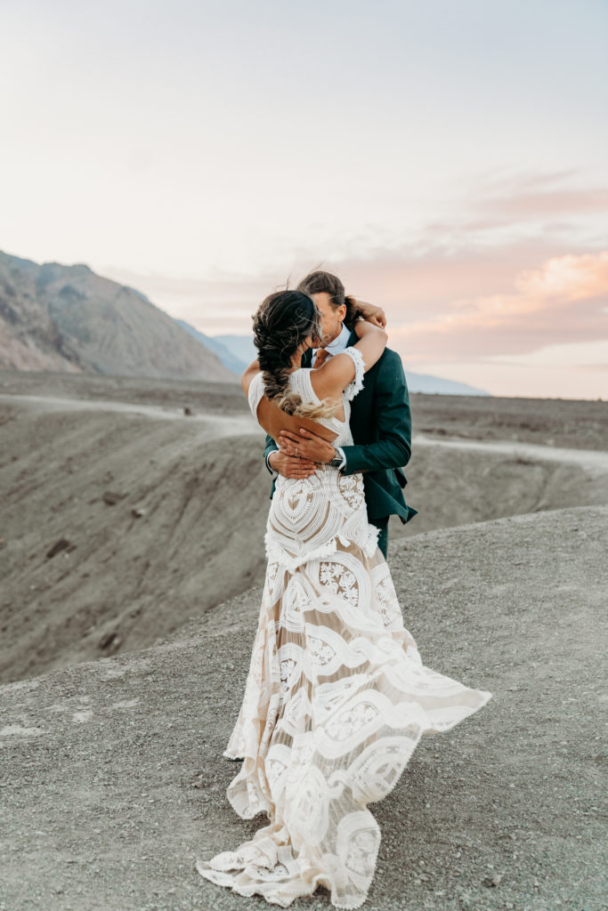 Bride and groom kissing in Death Valley Elopement