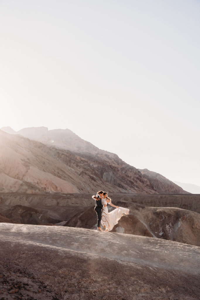 Death Valley Elopement bride and groom at sunset