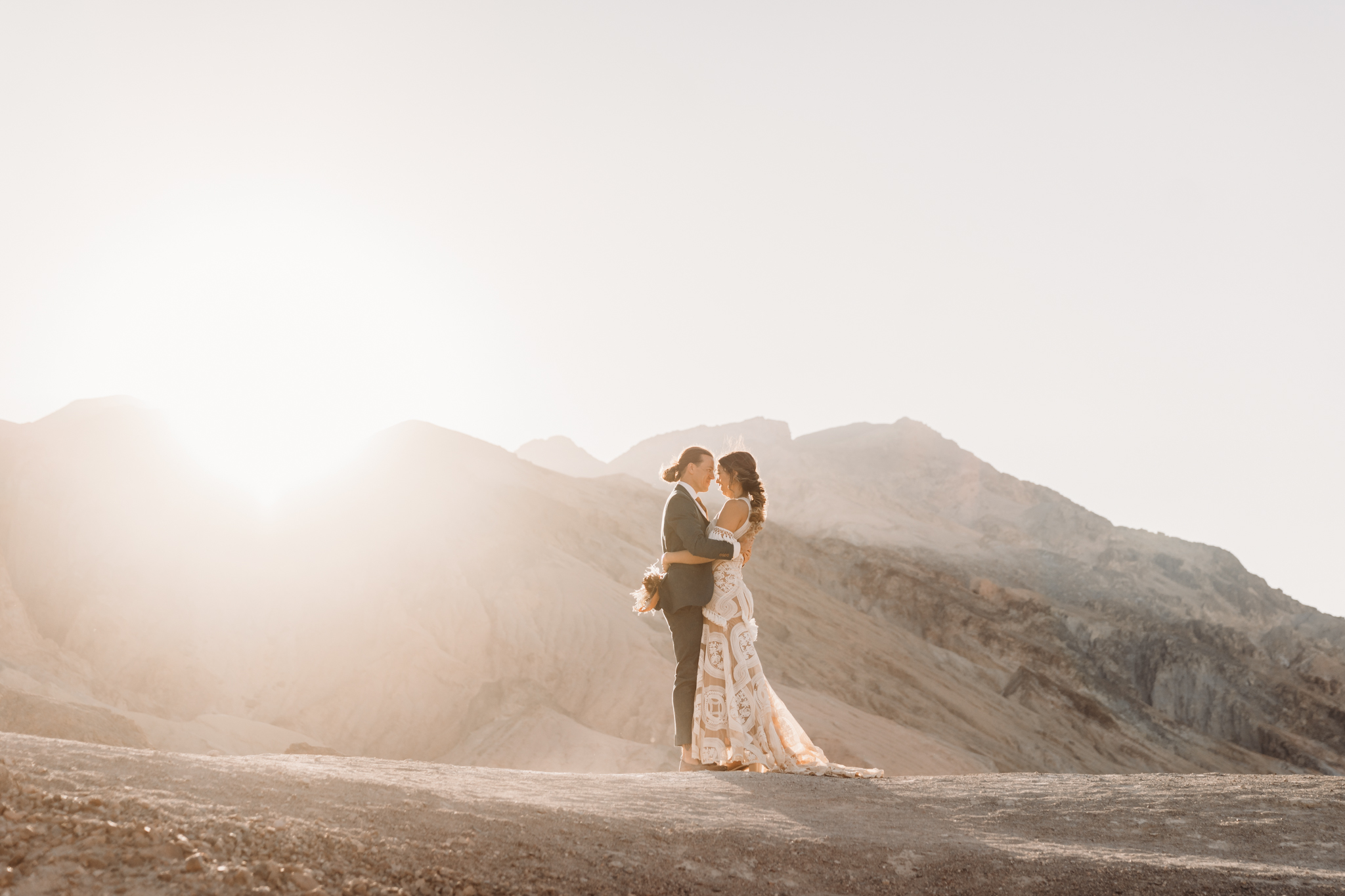 bride and groom embracing in Death Valley elopement
