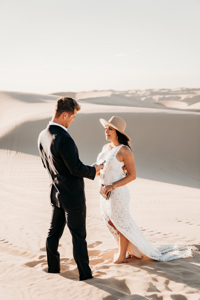 bride and groom at elopement ceremony in desert