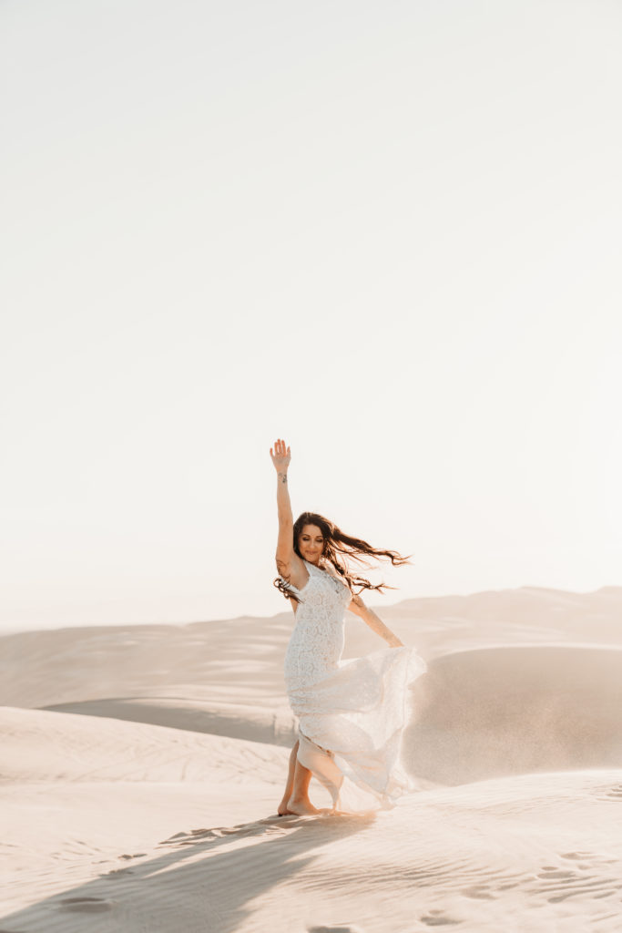 Bride spinning around in the desert