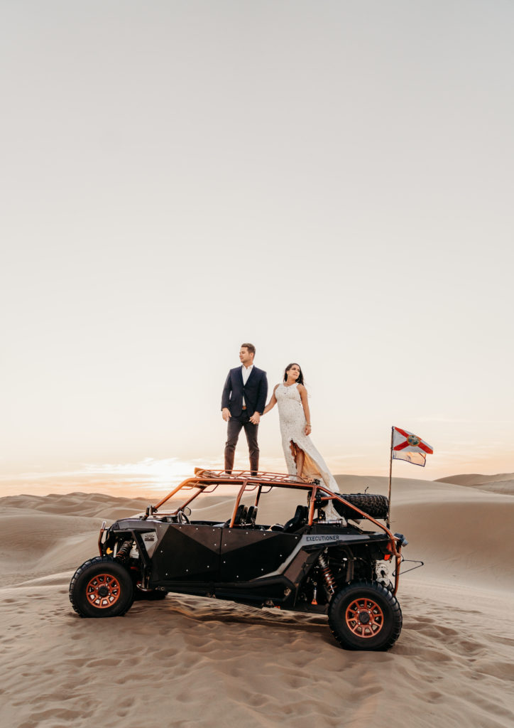 UTV with bride and groom standing on top
