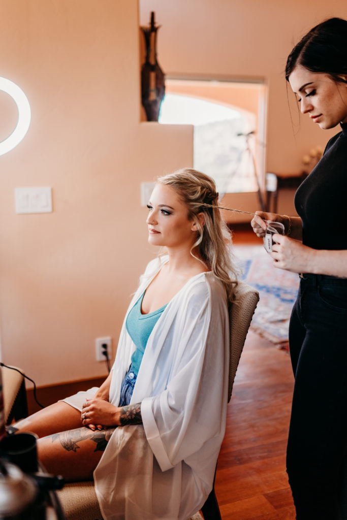 Woman getting hair ready for wedding