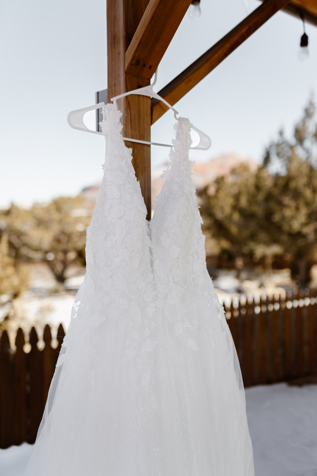 wedding dress hanging up 