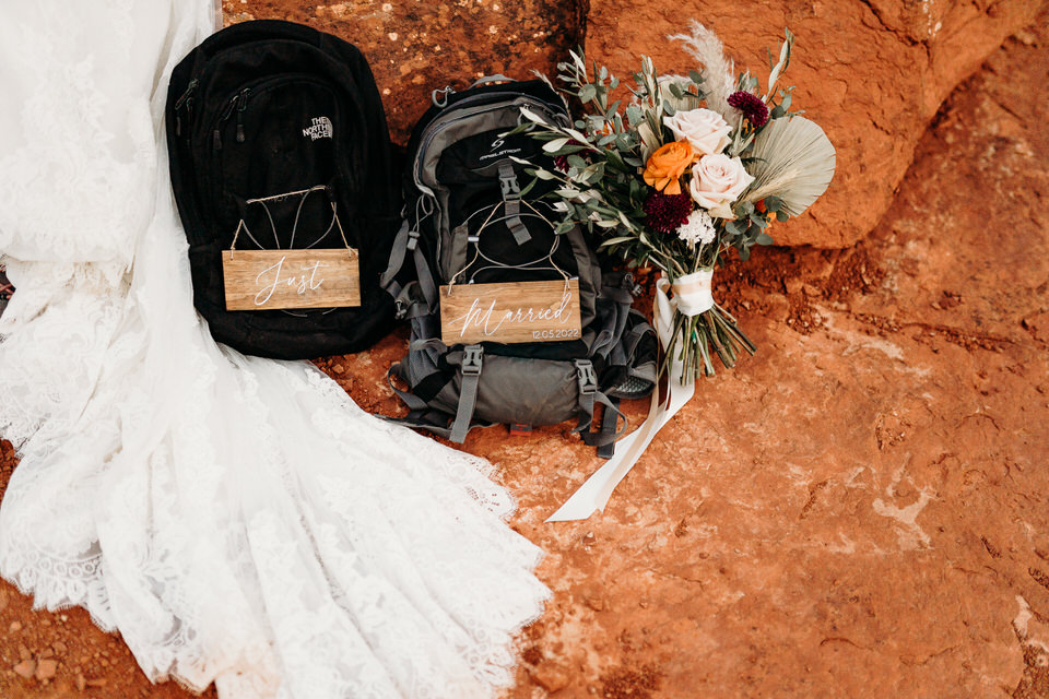 Elopement backpacks with wood signs