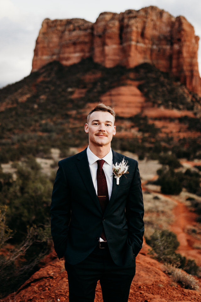 Baby Bell rock groom at sunset elopement