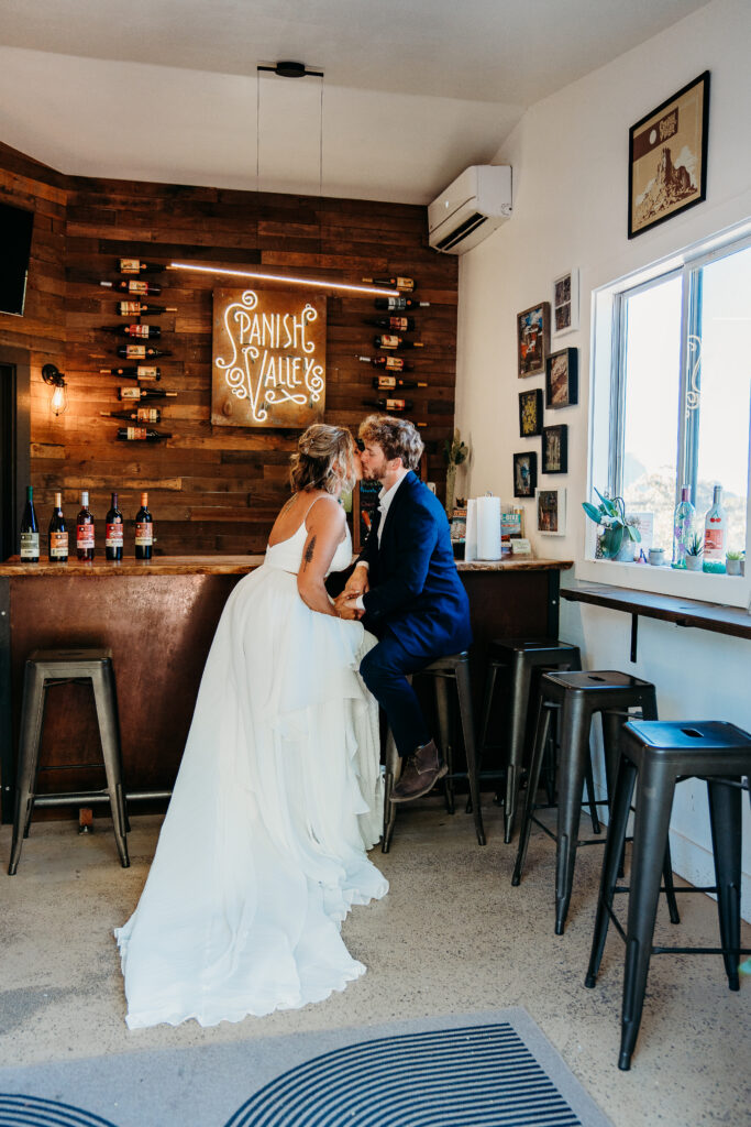 A Deadhorse Point elopement with a relaxed evening timeline, vineyard portraits, and an intimate sunset ceremony overlooking the canyon.