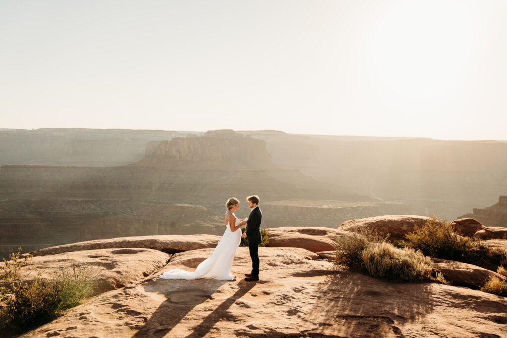 A Deadhorse Point elopement with a relaxed evening timeline, vineyard portraits, and an intimate sunset ceremony overlooking the canyon.