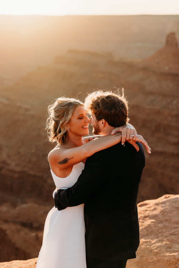 A Deadhorse Point elopement with a relaxed evening timeline, vineyard portraits, and an intimate sunset ceremony overlooking the canyon.