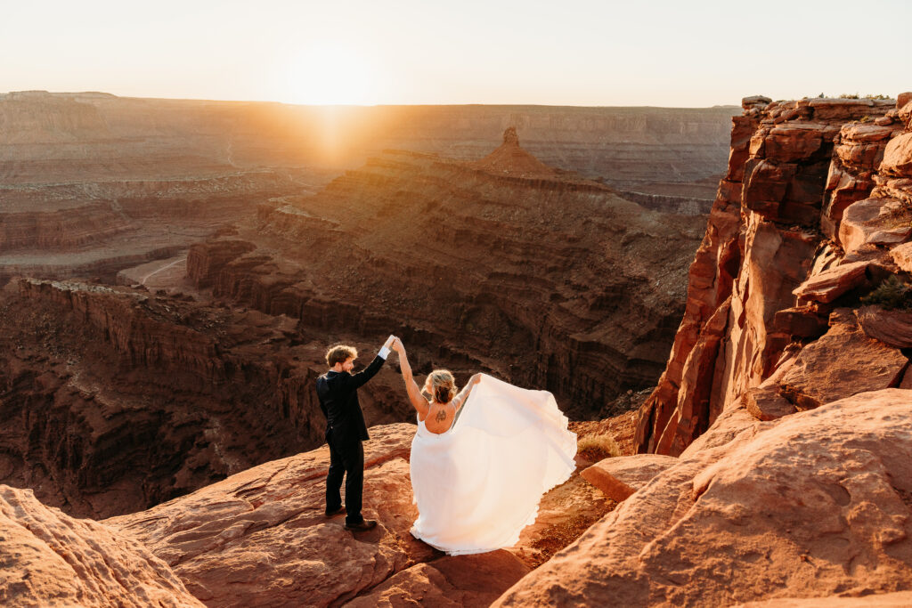 A Deadhorse Point elopement with a relaxed evening timeline, vineyard portraits, and an intimate sunset ceremony overlooking the canyon.