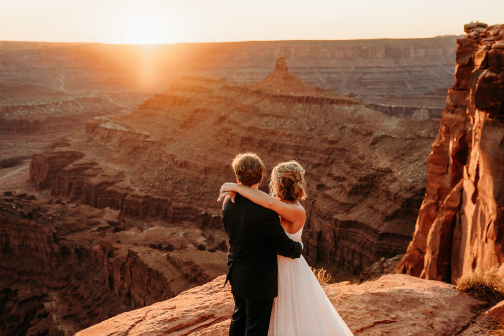 A Deadhorse Point elopement with a relaxed evening timeline, vineyard portraits, and an intimate sunset ceremony overlooking the canyon.