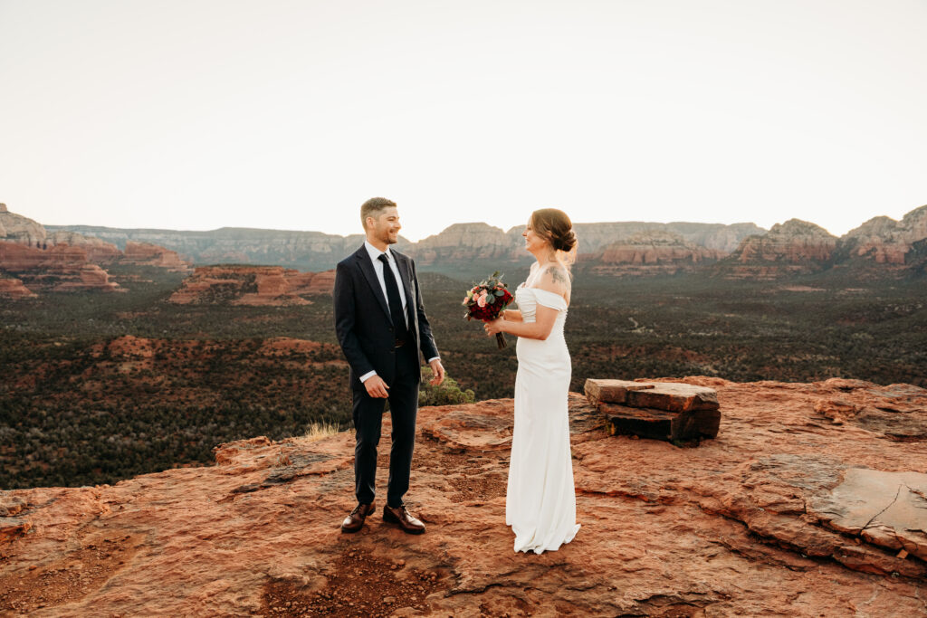 A backyard Sedona elopement with a sunrise hiking adventure and an intimate evening ceremony with family captured by Karen Castor Photography