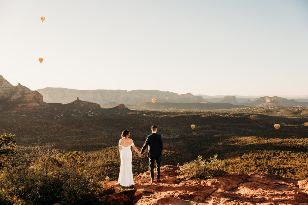 A backyard Sedona elopement with a sunrise hiking adventure and an intimate evening ceremony with family captured by Karen Castor Photography