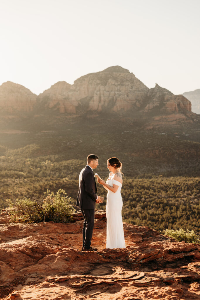A backyard Sedona elopement with a sunrise hiking adventure and an intimate evening ceremony with family captured by Karen Castor Photography