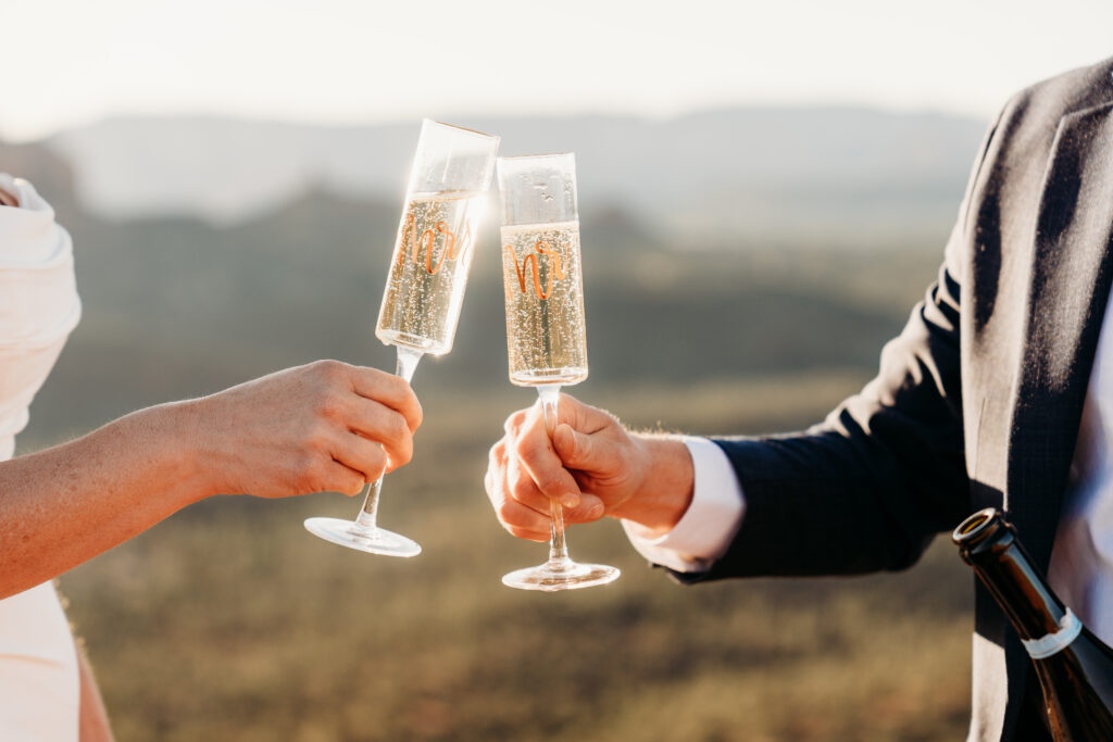 A backyard Sedona elopement with a sunrise hiking adventure and an intimate evening ceremony with family captured by Karen Castor Photography